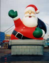 Santa balloons for rent - 20ft. Chimney Santa Claus inflatables.